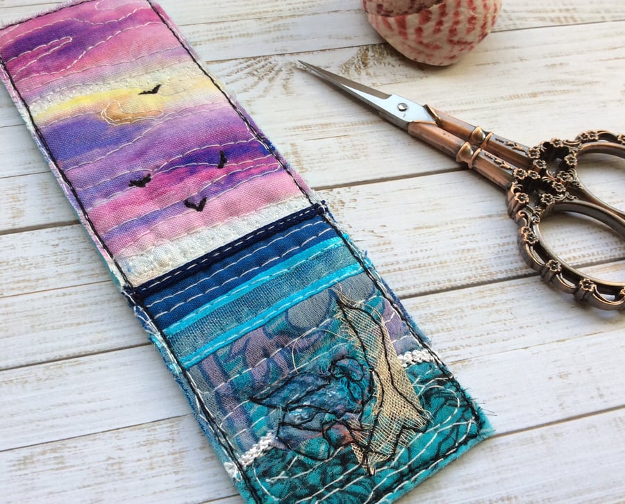 Embroidered up-cycled sunset seascape bookmark. 
