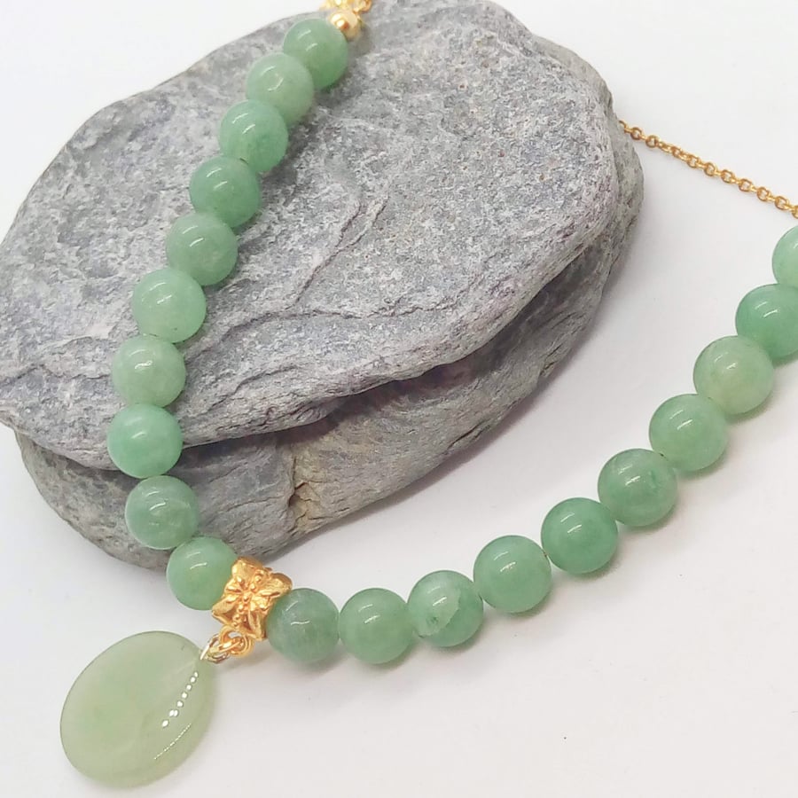 Green Jade Circular Pendant on a Soapstone Bead and Gold Chain Necklace