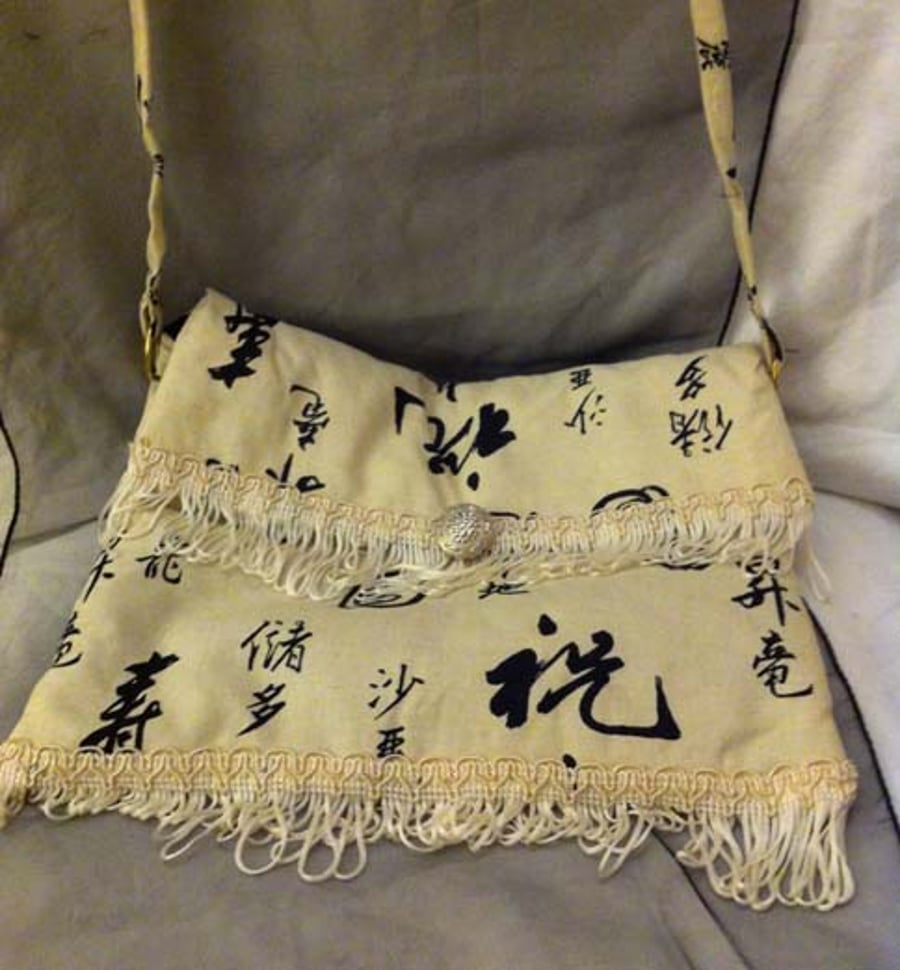  Small white chinese print bag with white trim