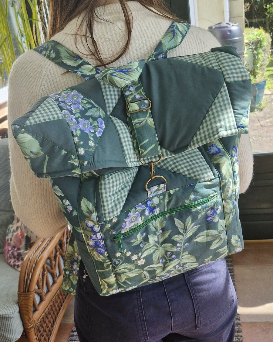 Large dark green mix quilted backpack with bronze hardware & mint lining