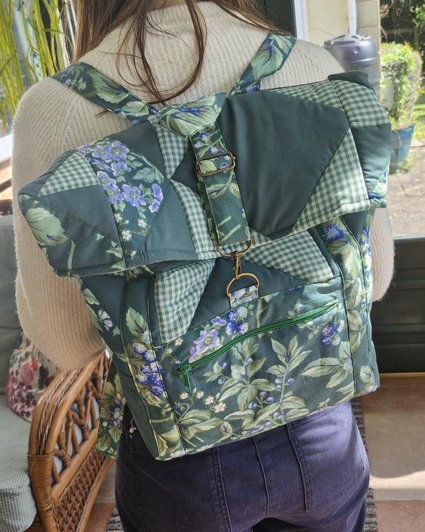 Large dark green mix quilted backpack with bronze hardware & mint lining