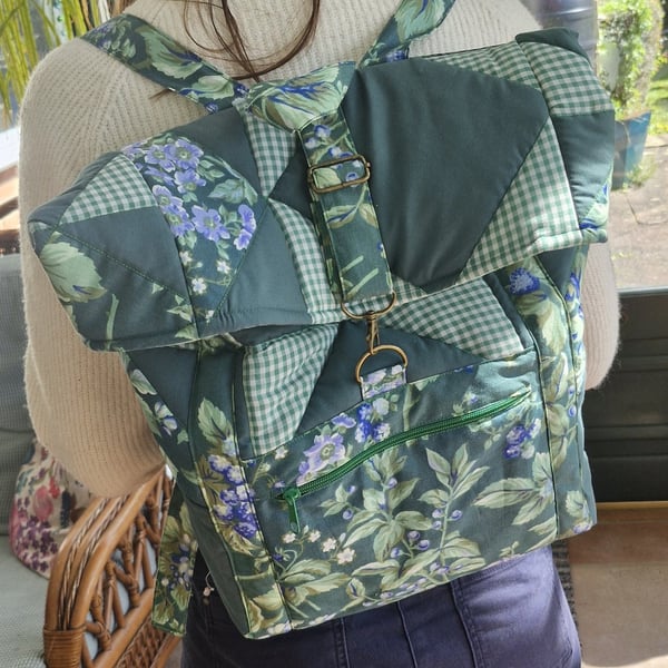 Large dark green mix quilted backpack with bronze hardware & mint lining