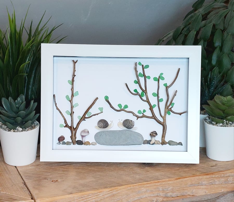 Cornish beach finds of driftwood, shells and seaglass woodland area framed art. 