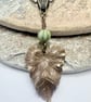 Sage green Czech glass and brass leaf pendant and earrings set, boho jewellery - Image 2