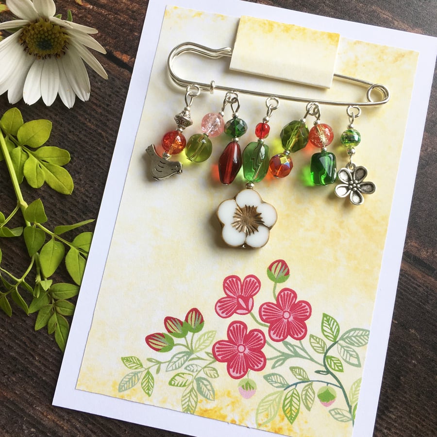 Embellished kilt pin in pink and green