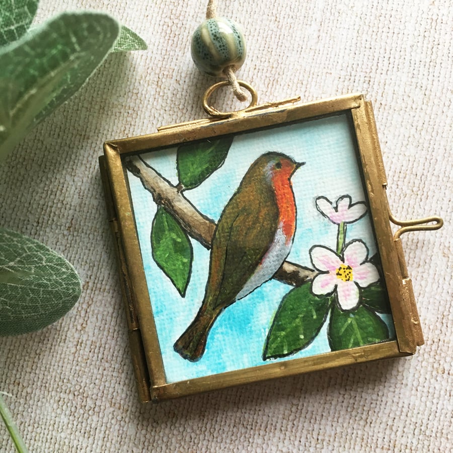 Miniature robin painting in metal frame