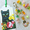 Bag charm. Black cat in a cuppa.