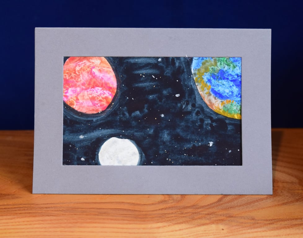 A red planet and a blue planet, with a moon - Watercolour