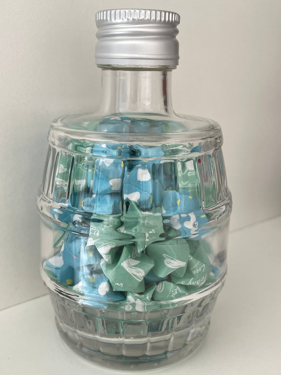 "Aqua Aura Dreams" - Folded Lucky Stars in whisky cask shaped bottle