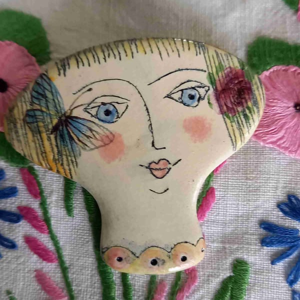 Lady face brooches 