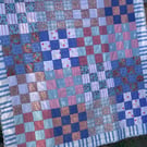 Pink and blue checkerboard quilt
