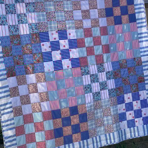 Pink and blue checkerboard quilt