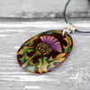 Thistle pyrography pendant. Hand burned and coloured floral necklace.