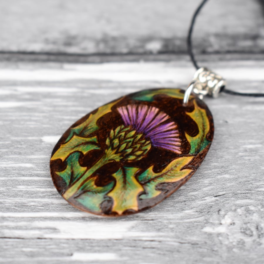 Thistle pyrography pendant. Hand burned and coloured floral necklace.