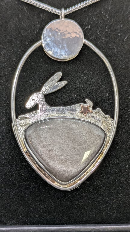 Sterling silver hare pendant with silver obsidian stone and red gold star detail