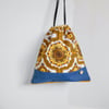 Drawstring bag orange retro with pompoms