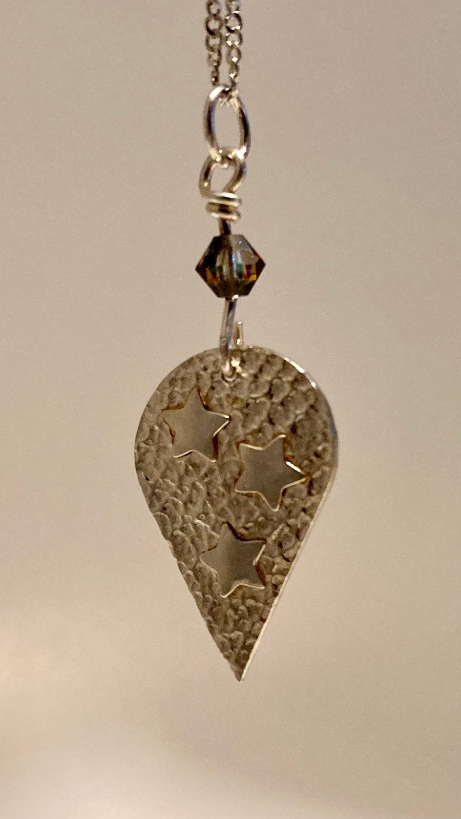 Pretty, pure silver necklace with 3 stars and a Swarovski crystal bead. 