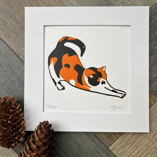 Stretching cat original reduction lino print 