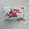 Small purse in cream, pink, blue and green floral fabric