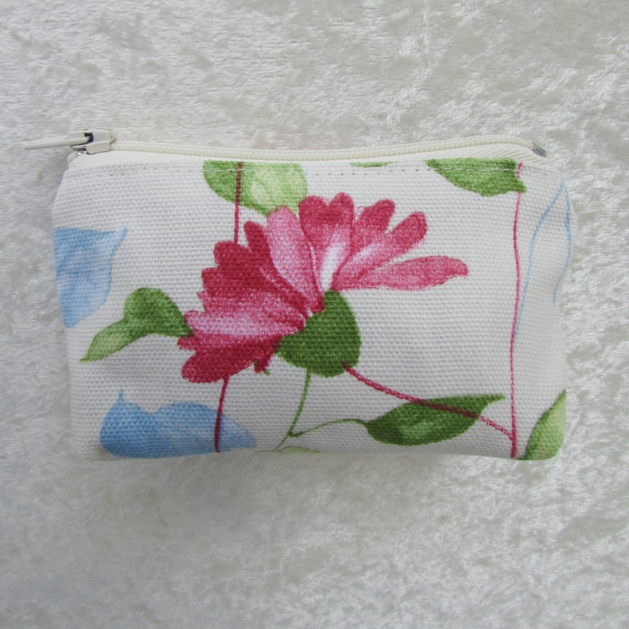 Small purse in cream, pink, blue and green floral fabric