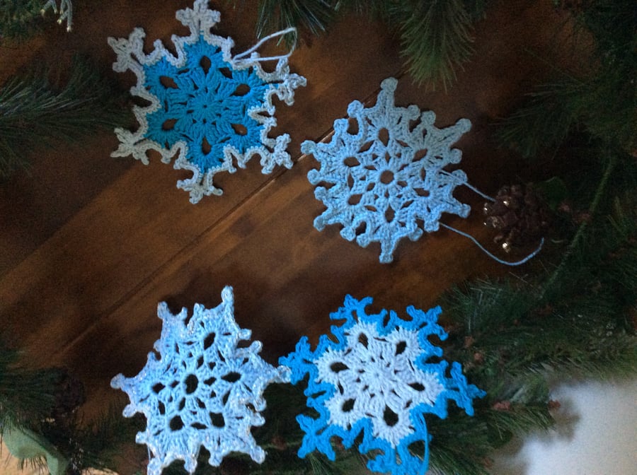 Set of 4 crochet snowflakes in blue 