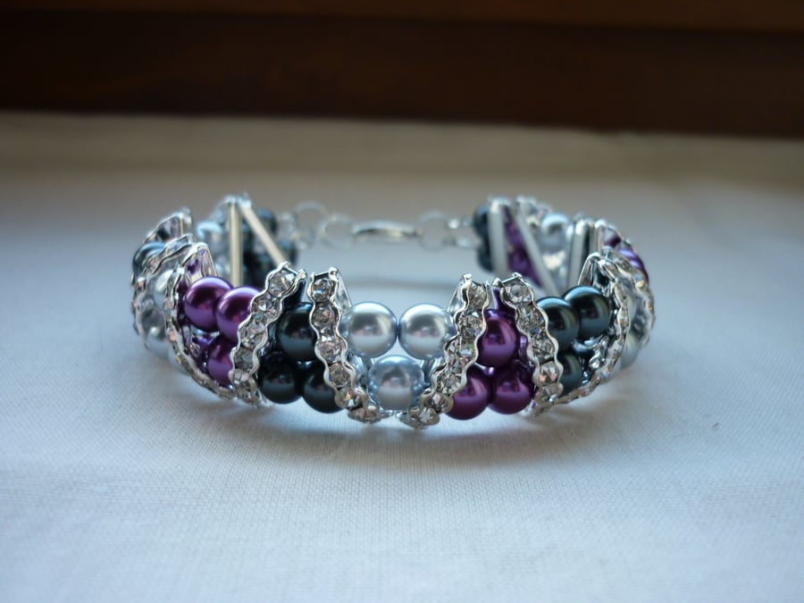 DARK GREY, SILVER AND MAGENTA RHINESTONE BRACELET.  928