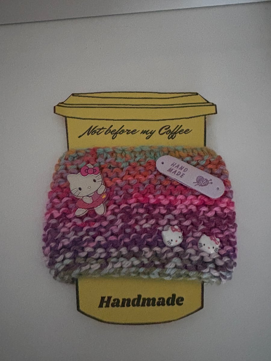 Hello Kitty and friends knitted cup cosy. 