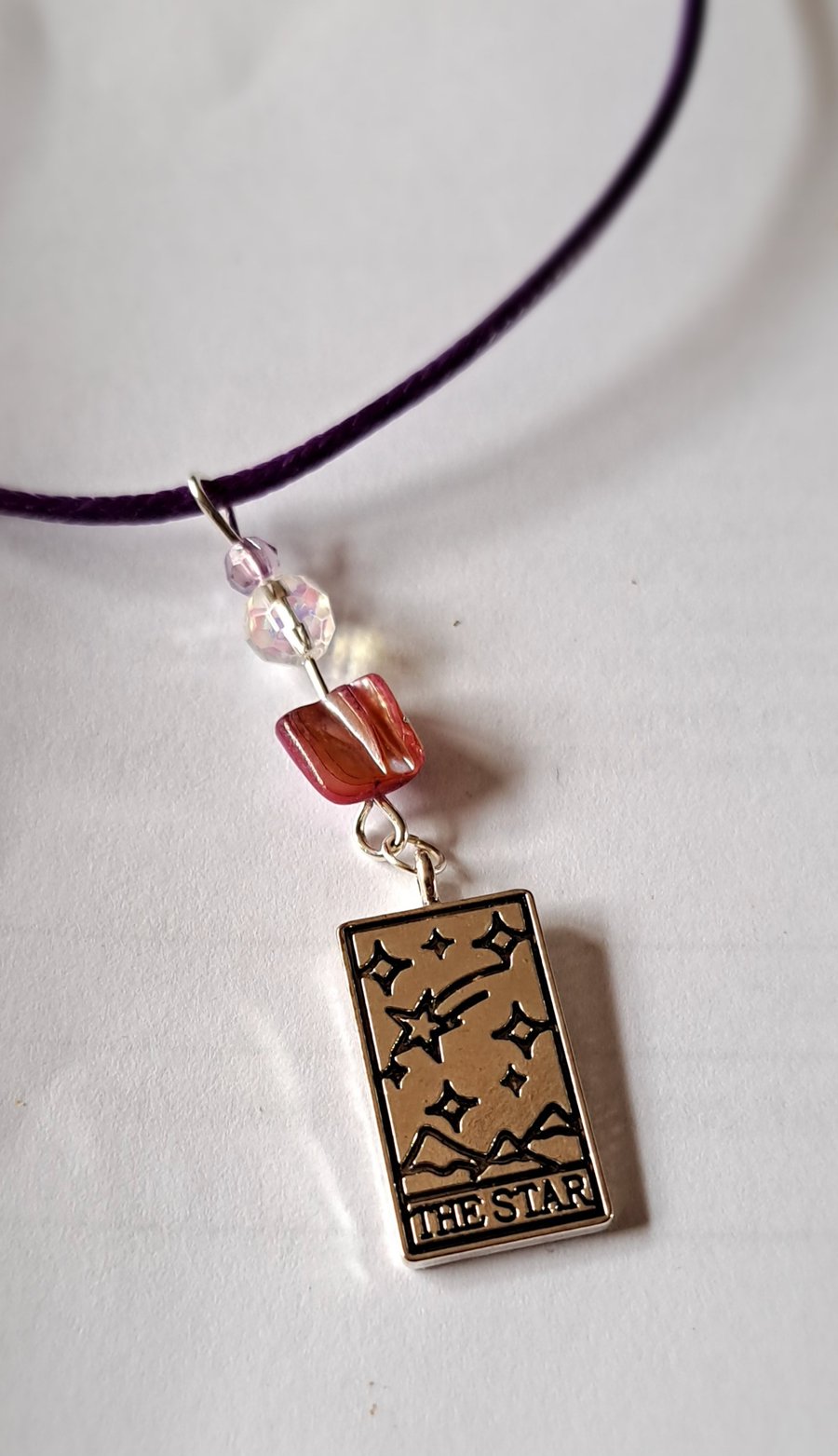 Tarot 'The Star' pendant on a purple rope necklace