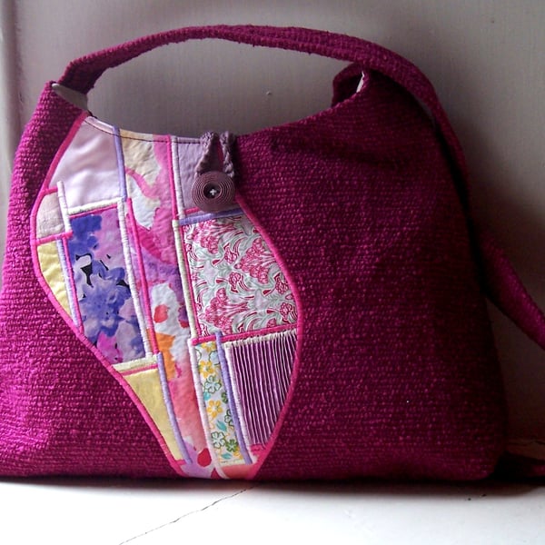 Soft fabric shoulder bag in magenta and pink with patchwork feature