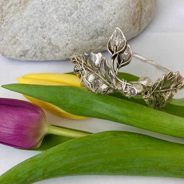 Unique Bangle Featuring Large Leaves With Beautiful Double Flower Charm - Silver
