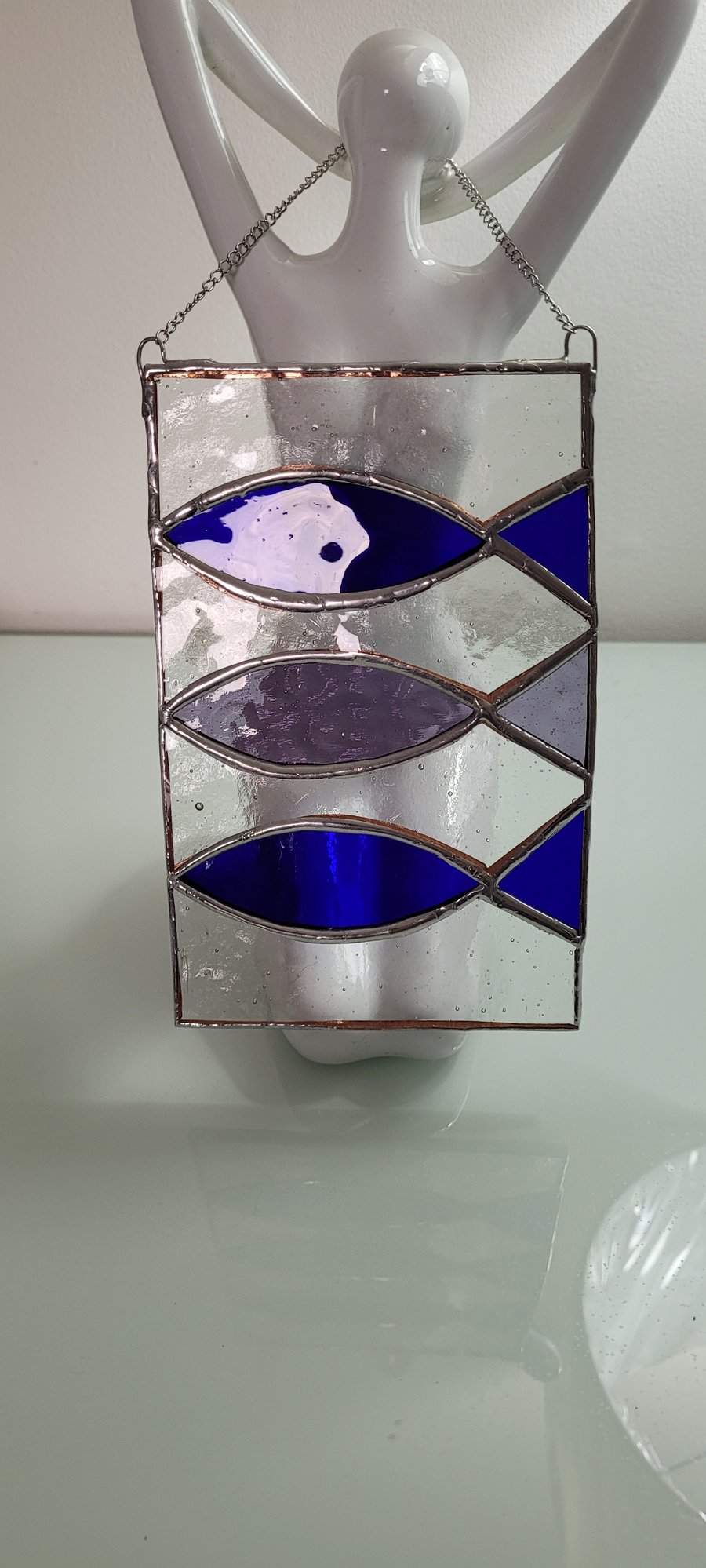 Stained glass fish swimming 