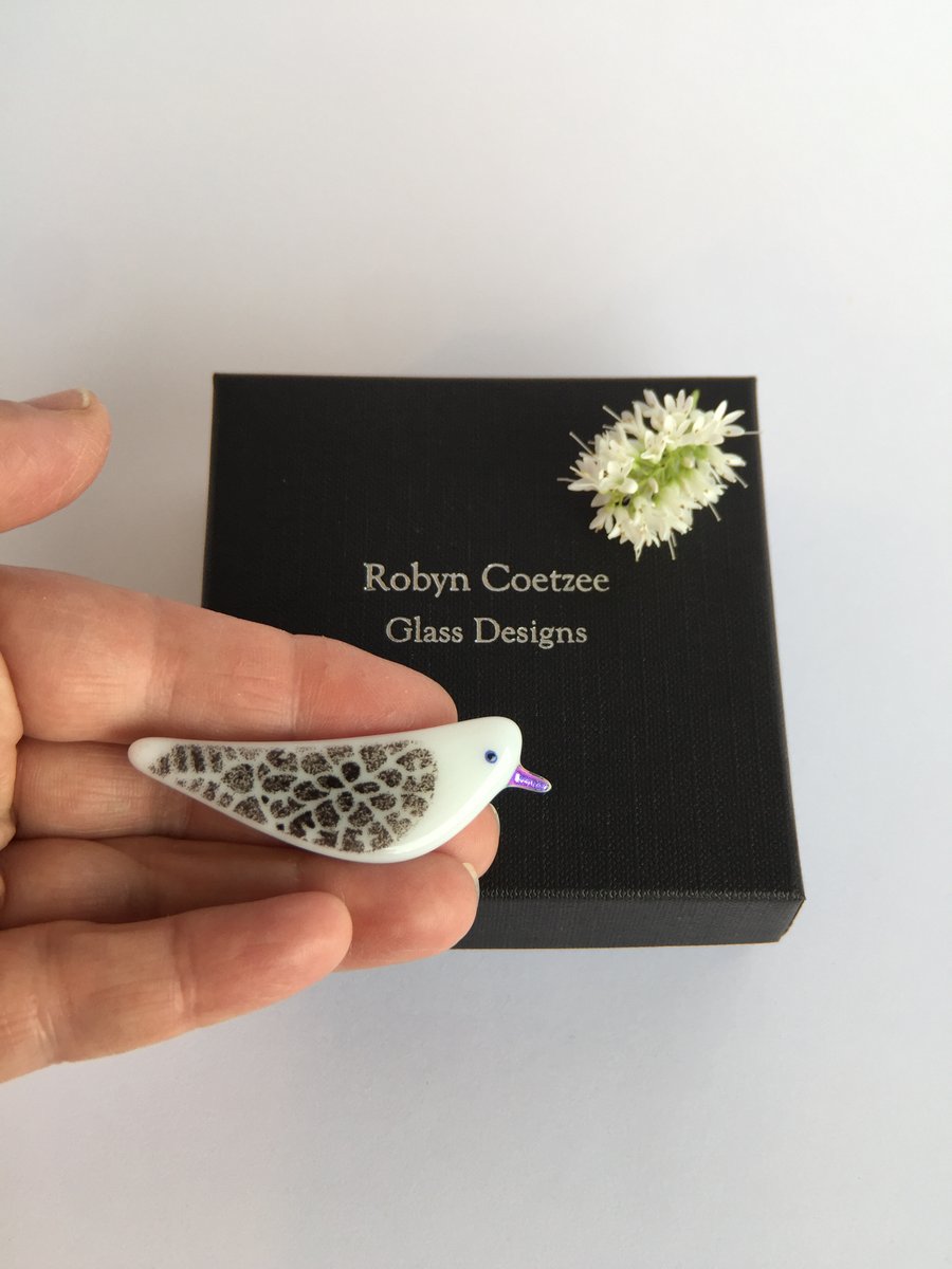 Black and white bird brooch with pink beak