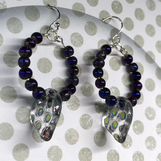 Purple hoop earrings with peacock vittrail leaf beads