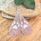White wolf paw print beaded fringe earrings in rose pink and silver