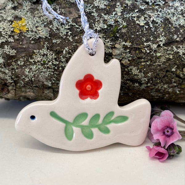 Teeny ceramic dove decoration with leaves and red flower