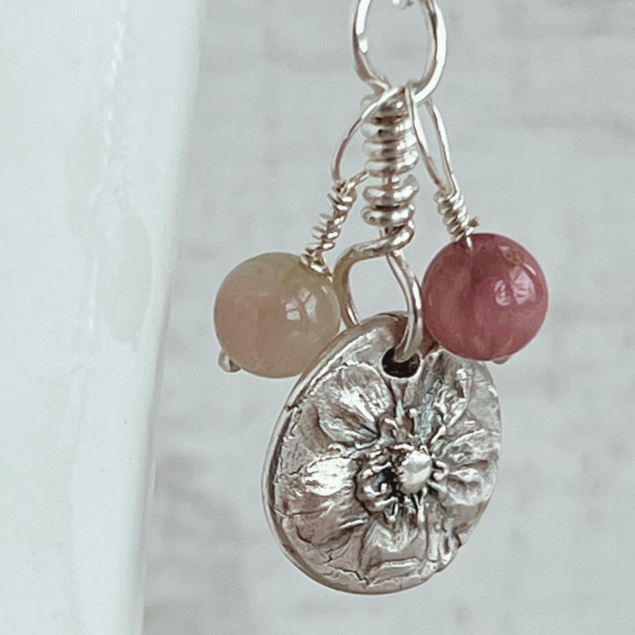 Botanical silver pendant with wild strawberry flower and tourmaline beads.
