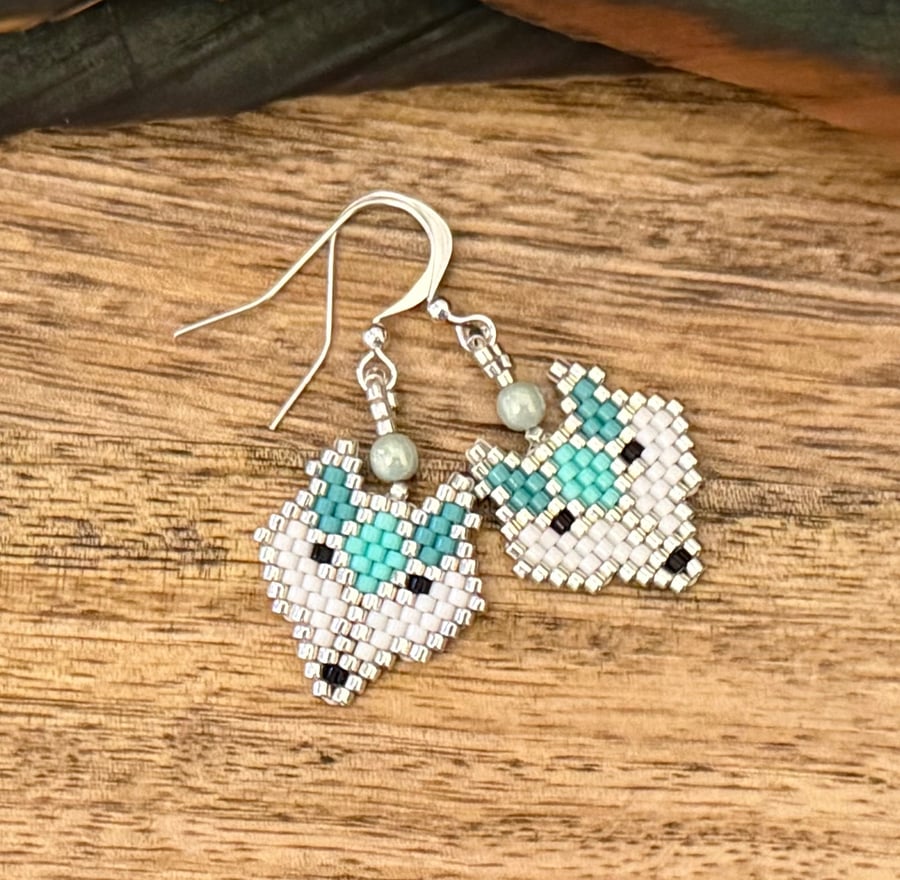 Geometric bead woven blue fox earrings