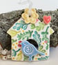 Small Ceramic bird house decoration with yellow flower