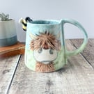 Handmade porcelain highland cow mug. Cup. Hand painted