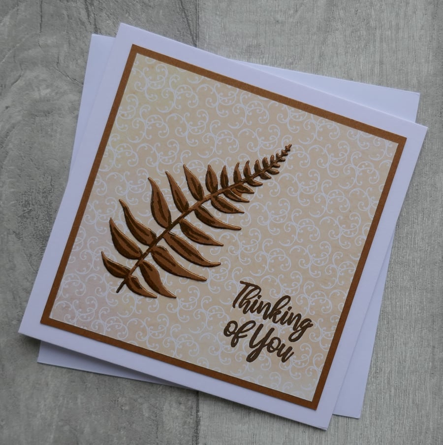 Brown Embossed Fern with Peach Swirl Background 'Thinking of You' Card