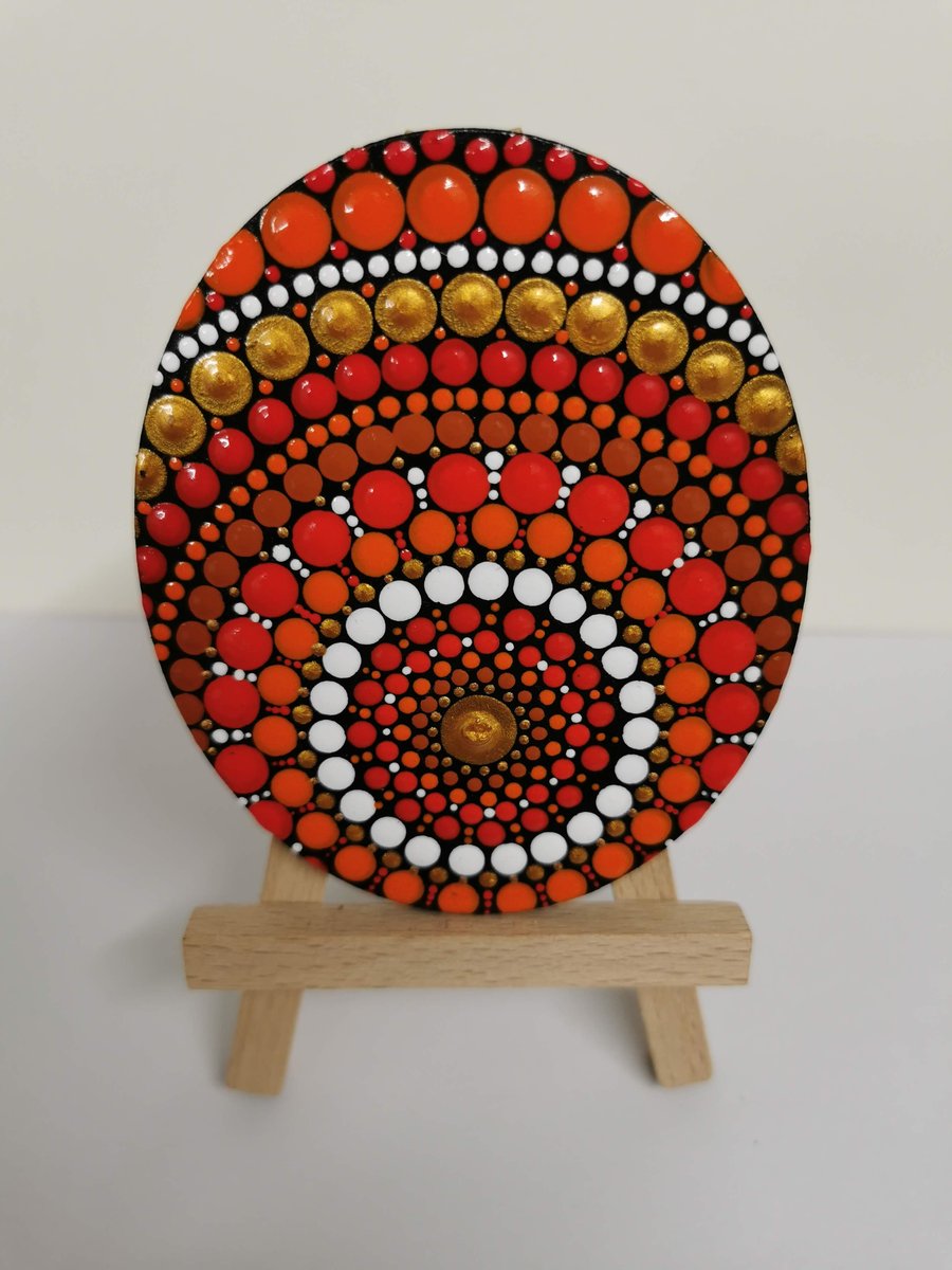 Hand painted red and orange mandala decorative piece