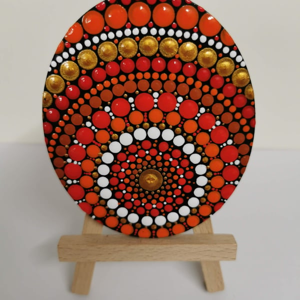 Hand painted red and orange mandala decorative piece
