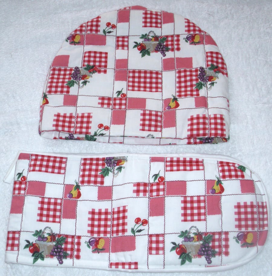 Baskets of Fruits on a red check  tea cosy and ovengloves