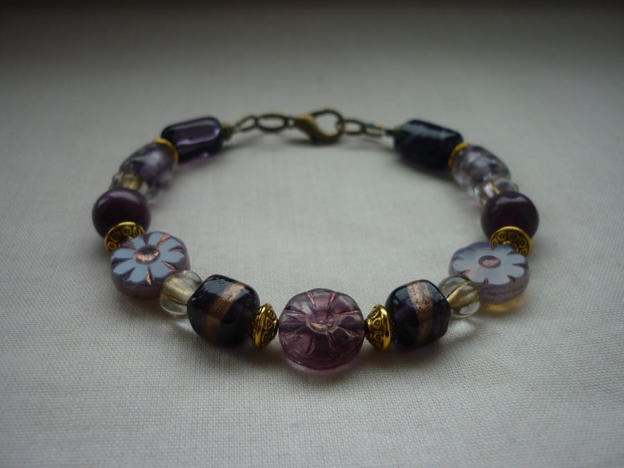 MAUVE, PURPLE, LILAC AND BRONZE BRACELET.  1087