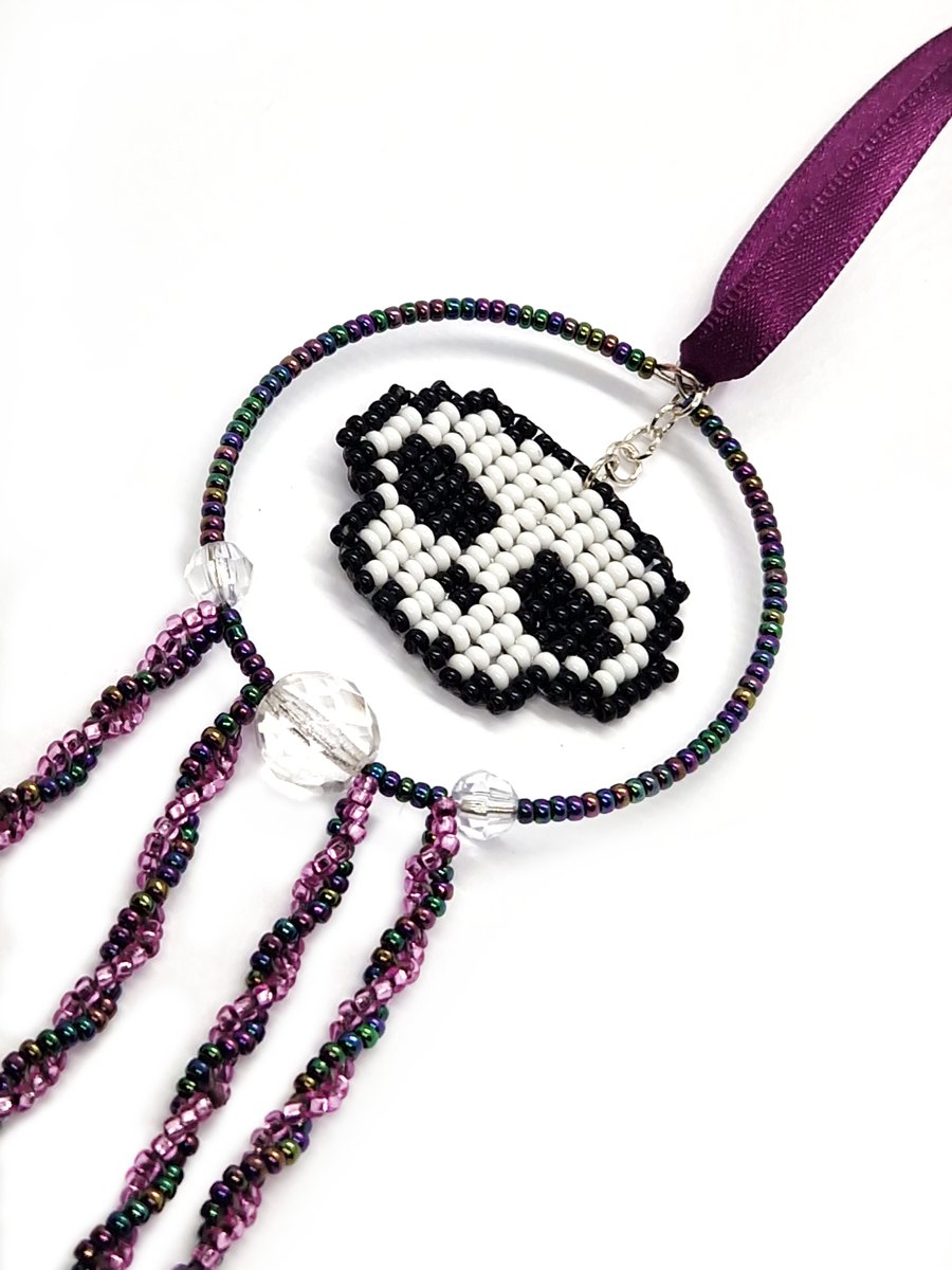 Purple white and black beaded skull hanging decoration