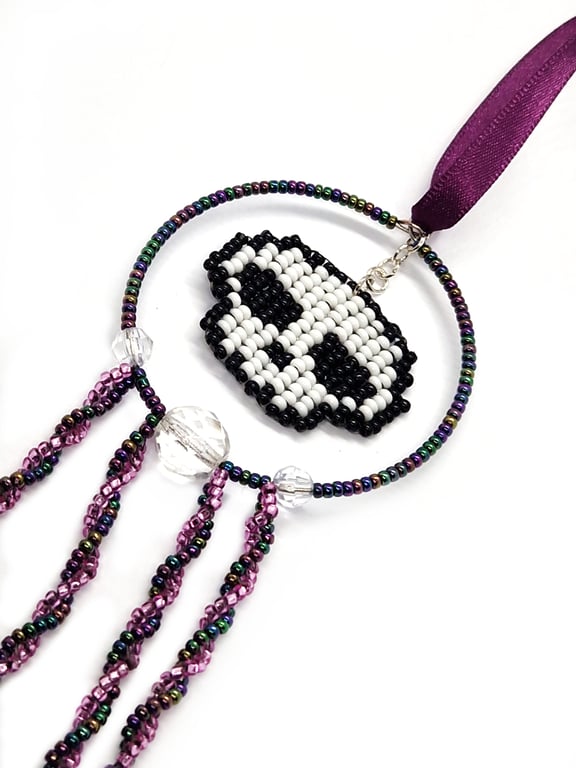 Purple white and black beaded skull hanging decoration