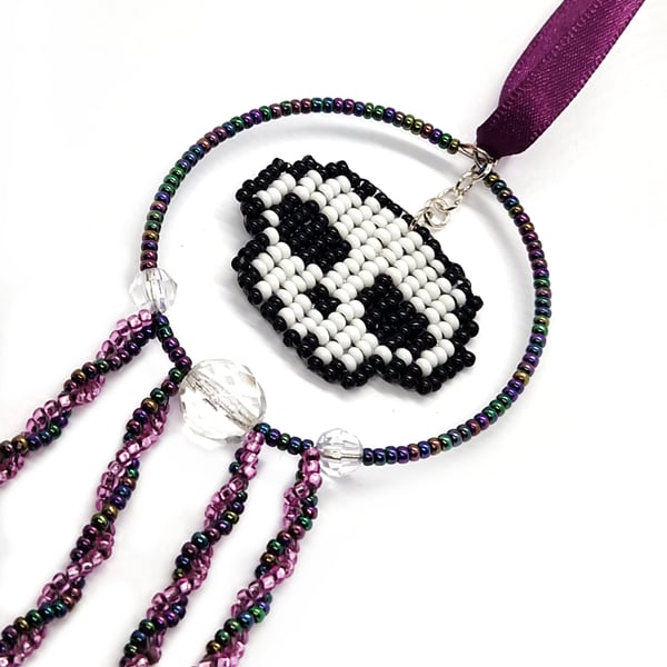 Purple white and black beaded skull hanging decoration
