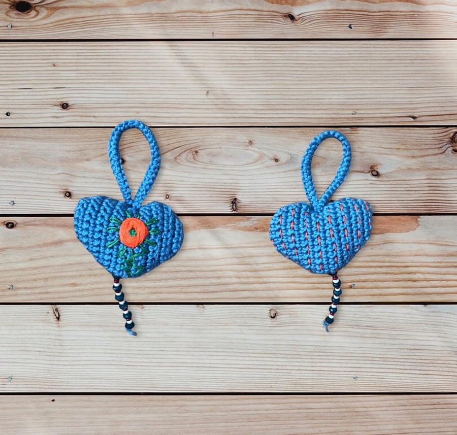 Padded hanging sea blue crochet heart with green and orange embroidery …..