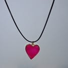 Handmade resin pink shimmer heart pendant on  black waxed cord