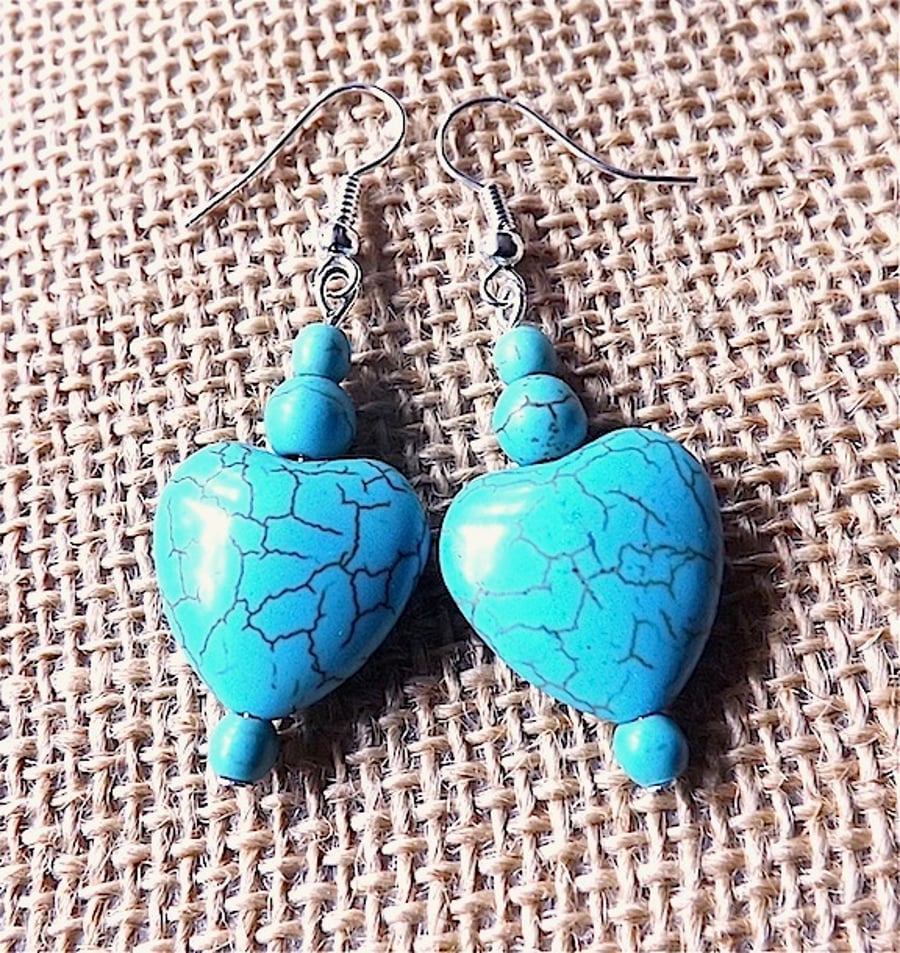 Earrings for pierced ears, Turquoise gem stone  heart dangles.